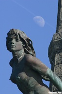 Aberystwyth war memorial, lower figure.  (400mm lens to foreshorten the moon.)