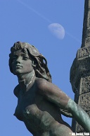 Aberystwyth war memorial, lower figure.  (400mm lens to foreshorten the moon.)