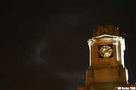 Station clock, stormy night.